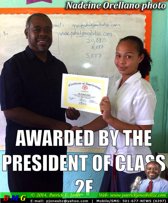 Nadeine Orellano presents certificate to Patrick E. Jones