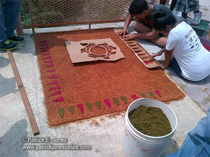 Making sawdust carpets (Orange Walk town)